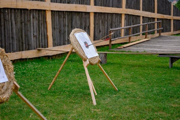 Backyard archery range setup with target and shooting lane