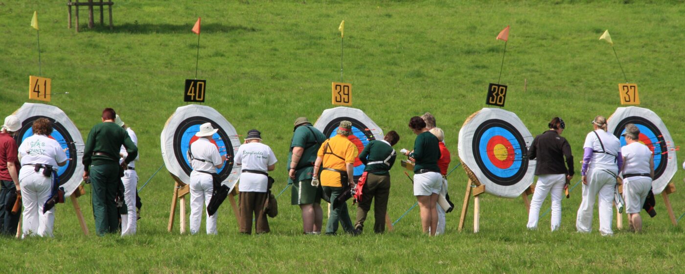 Archers scoring and collecting arrows at competition - Dunster Archery Somerset