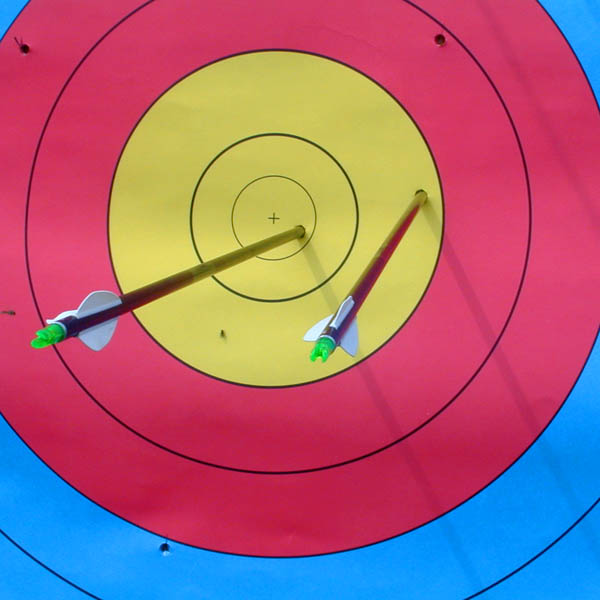 Olympic archery target with arrows showing scoring rings