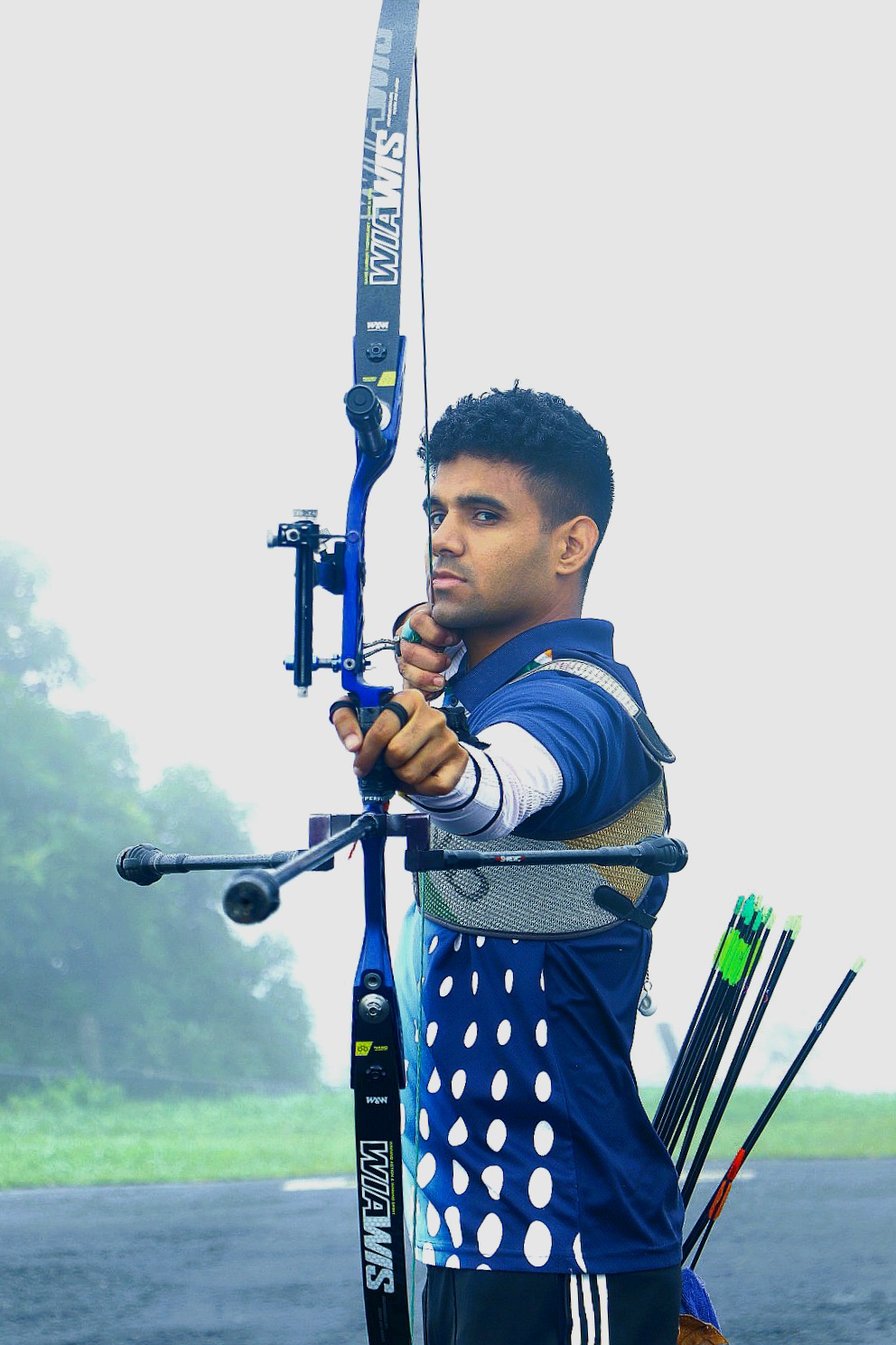 Archer facing camera with bow - Wikimedia Commons