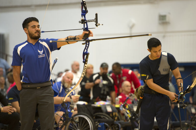 Archery competition showing arrow fletching importance for accuracy