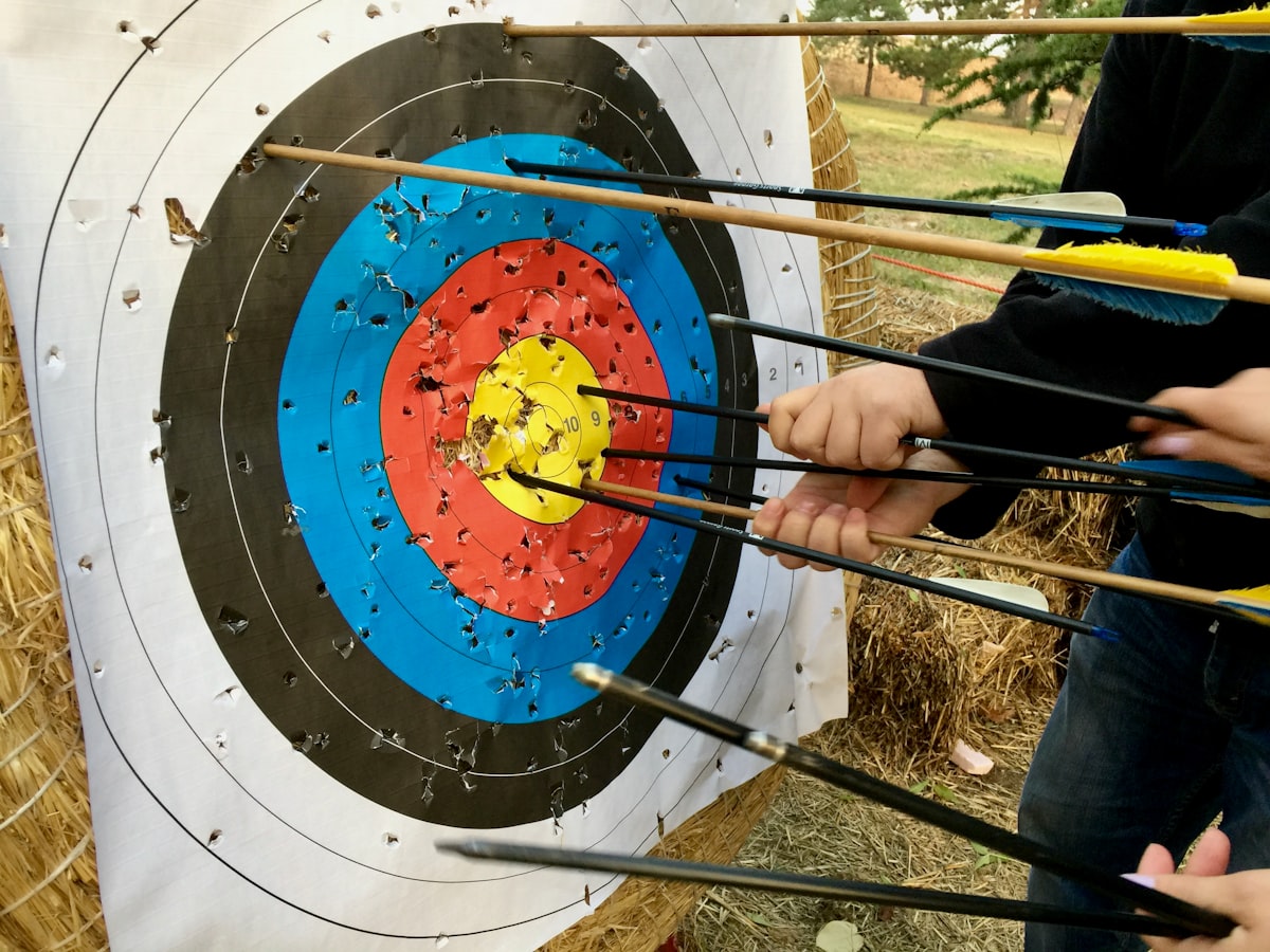 Group archery training session building endurance through repetitive practice