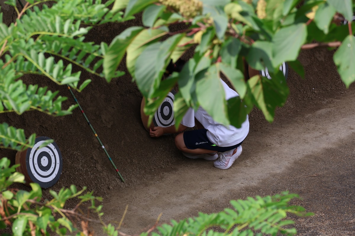Archer setting up archery target for recurve bow practice session