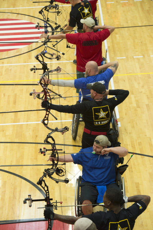 Archery release aid guide - compound bow archer using wrist release at full draw during competition