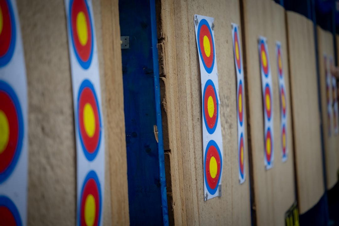 Archery targets lined up on practice wall for form drills
