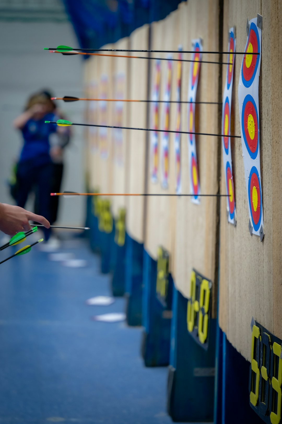 Archery targets with arrows showing consistent grouping from well-maintained bowstring
