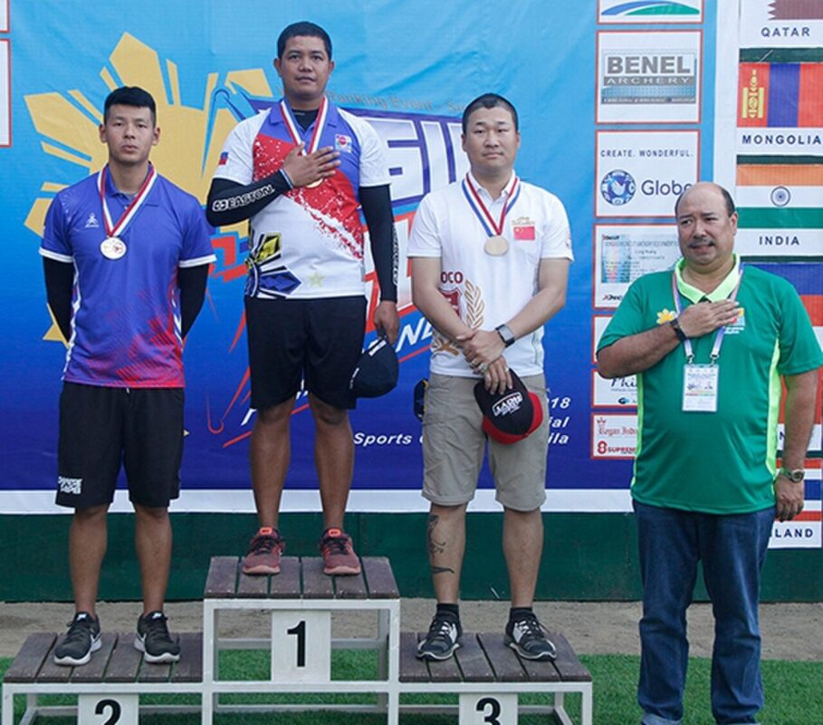 Compound archers compete in an outdoor 50-metre target competition — the format where Sebastian Garcia shot 719 out of 720