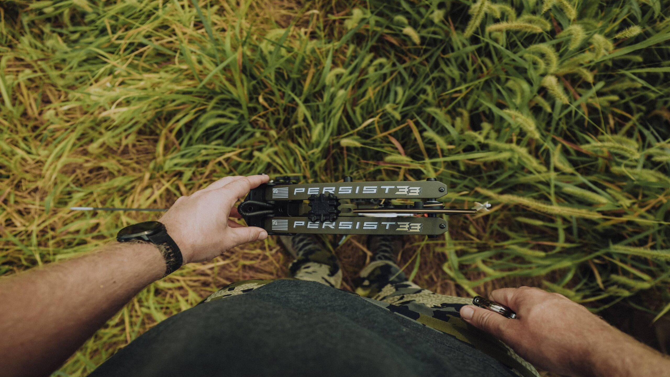 Compound bow draw length adjustment settings and cam system close-up