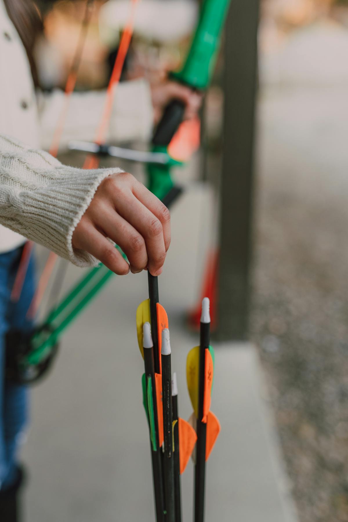 Hunter selecting and inspecting hunting arrows for compound bow broadhead compatibility