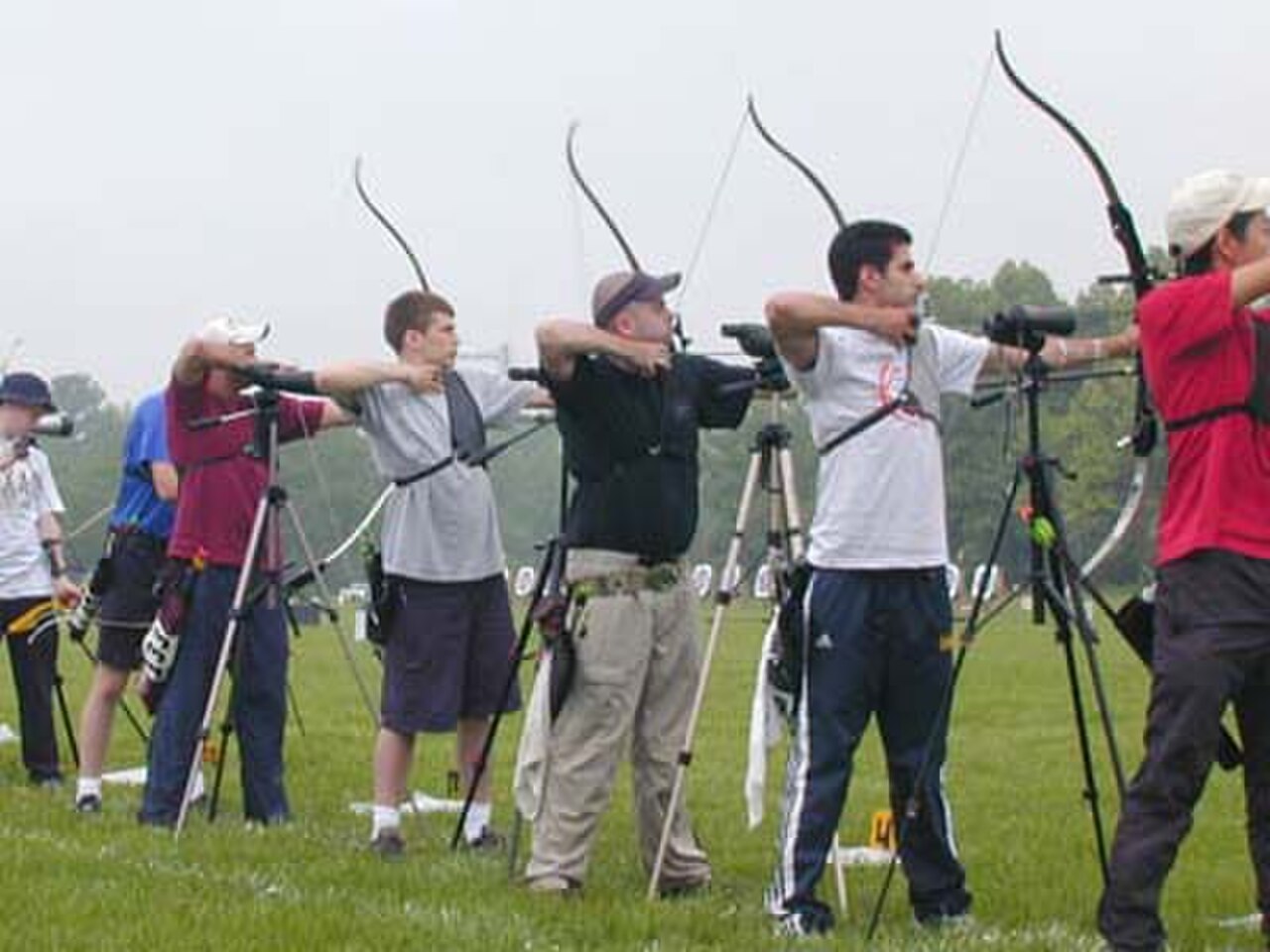 Outdoor archery competition field with targets at distance — the stage for compound and recurve archery world records