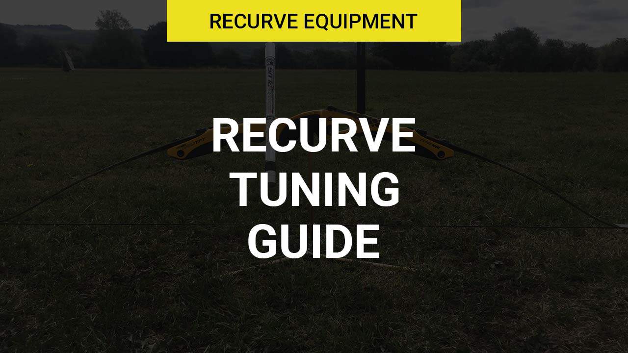 Recurve bow tuning setup with arrows and target at archery range