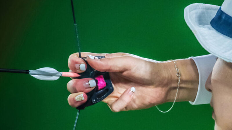 archery arm guard on elite recurve archer at full draw