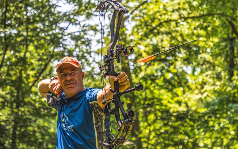 Compound bow being tested at archery range showing hunting setup