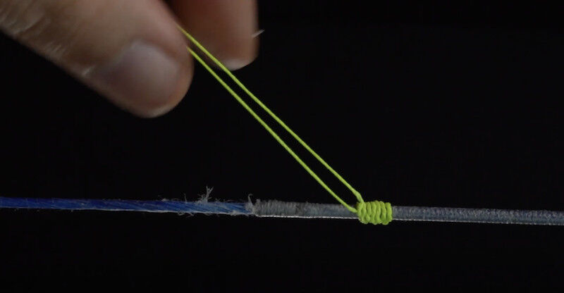 Archery nocking point step 3 tightening serving knots