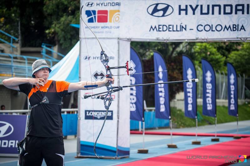 Archer demonstrating proper recurve bow aiming and shooting form