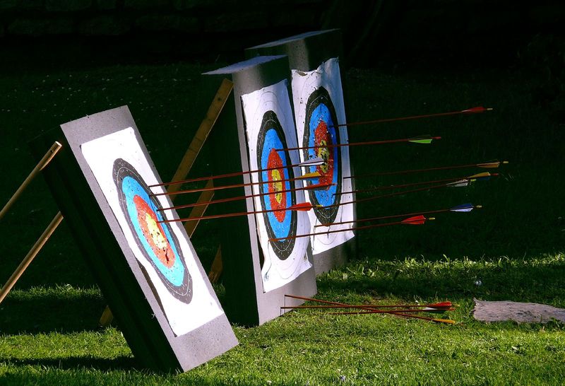 Target panic misses scattered across an archery target face
