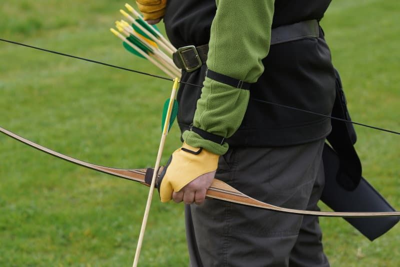Traditional longbow archer — Dacron strings outlast modern materials