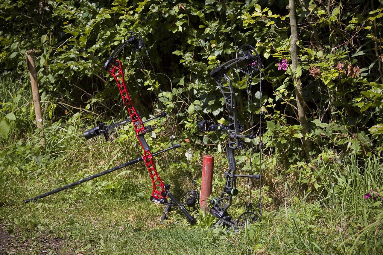modern compound bow with cams and cables close-up