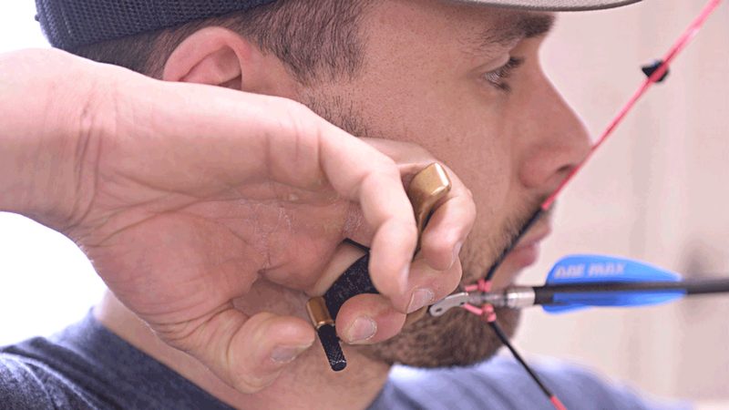 Hinge back tension release aid for target panic archery cure