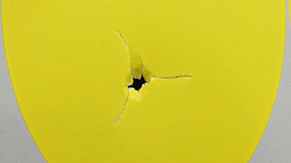 Perfect bullet hole tear on paper tuning chart