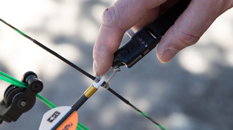 Archery release aid index finger style attached to the D-loop on a compound bow