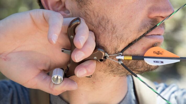 Archery release aid thumb style at full draw bowhunting