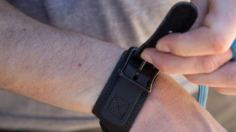 Wrist strap archery release aid buckle close up to compare with thumb release switch