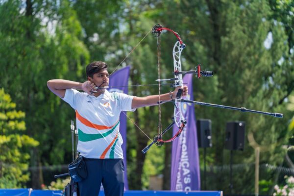 Compound bow archer at full draw with proper arrow spine setup