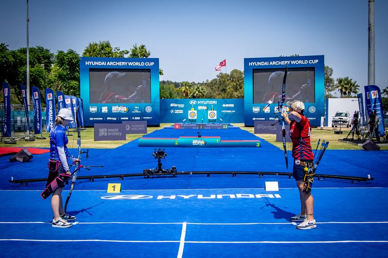 Recurve archers competing with matched arrow spine during tournament match