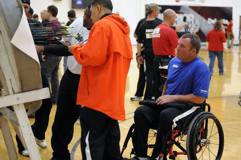 Para archer competing in an adaptive archery ranking event