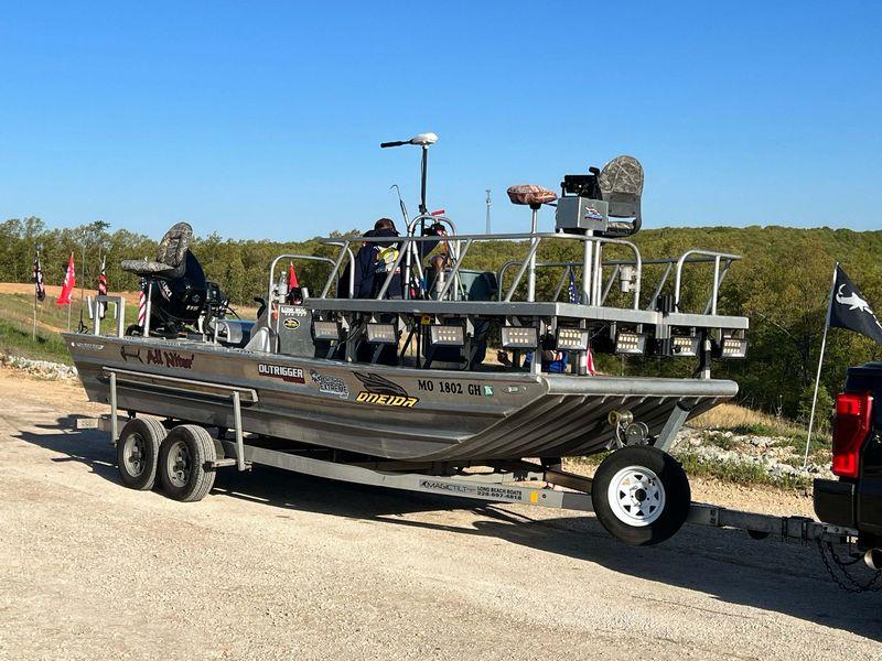 Tournament bowfishing boat with deck rails and lights