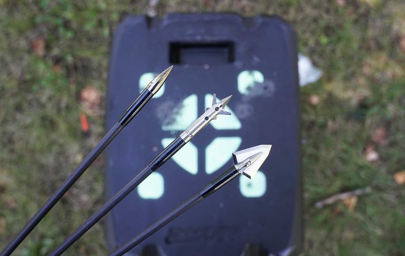 Three broadheads next to a field point for broadhead tuning comparison
