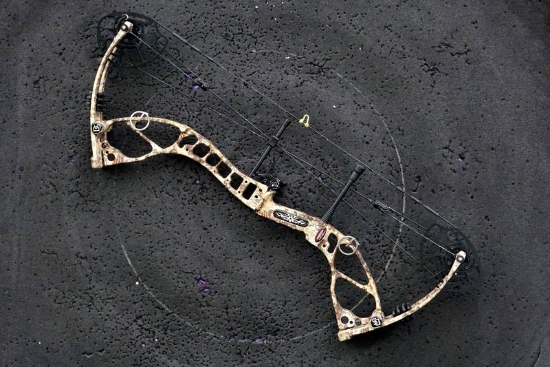 Compact compound bow showing weight advantage over crossbow