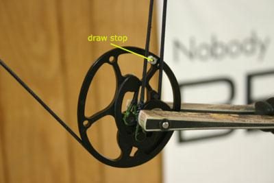 Compound bow draw stop labeled, the key contact point for checking cam timing