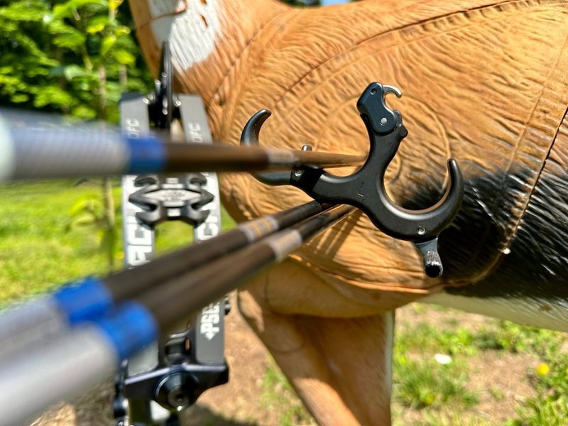 Compound bow release aids hooked to arrows for a clean quiet shot