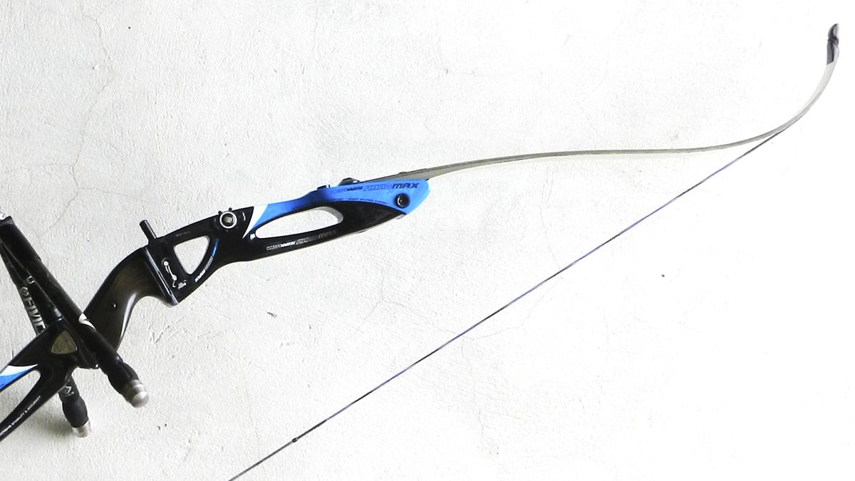 Compound bow string and recurve limb close-up showing bowstring needing wax