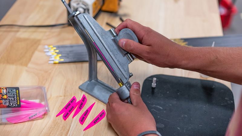 Fletching jig and pink vanes for arrow building