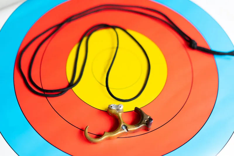 Hinge release drawing technique drill with practice string and target