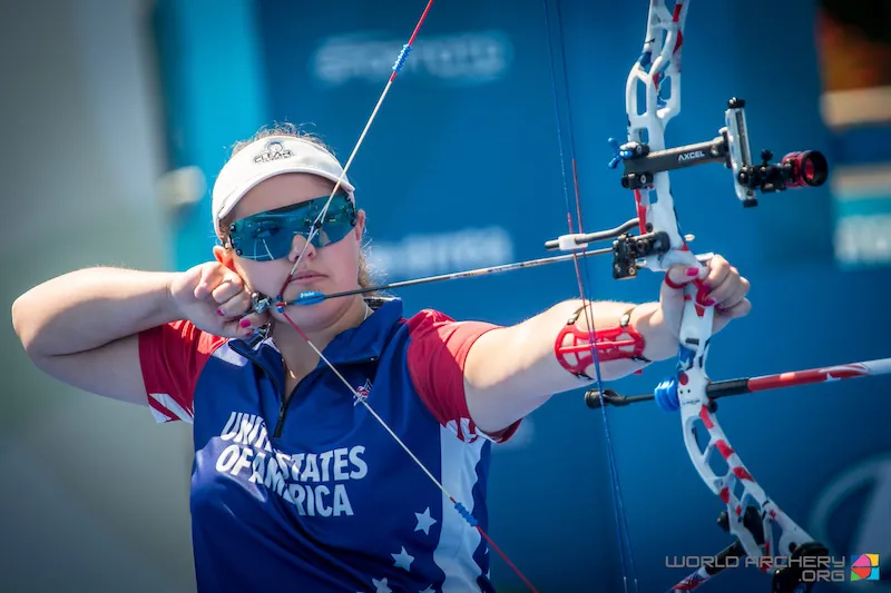 Compound archer at full draw demonstrating hinge release archery anchor and back tension