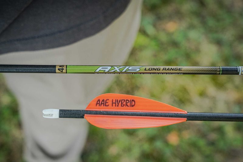 Hunting arrow and vane that affect kinetic energy at a given draw weight