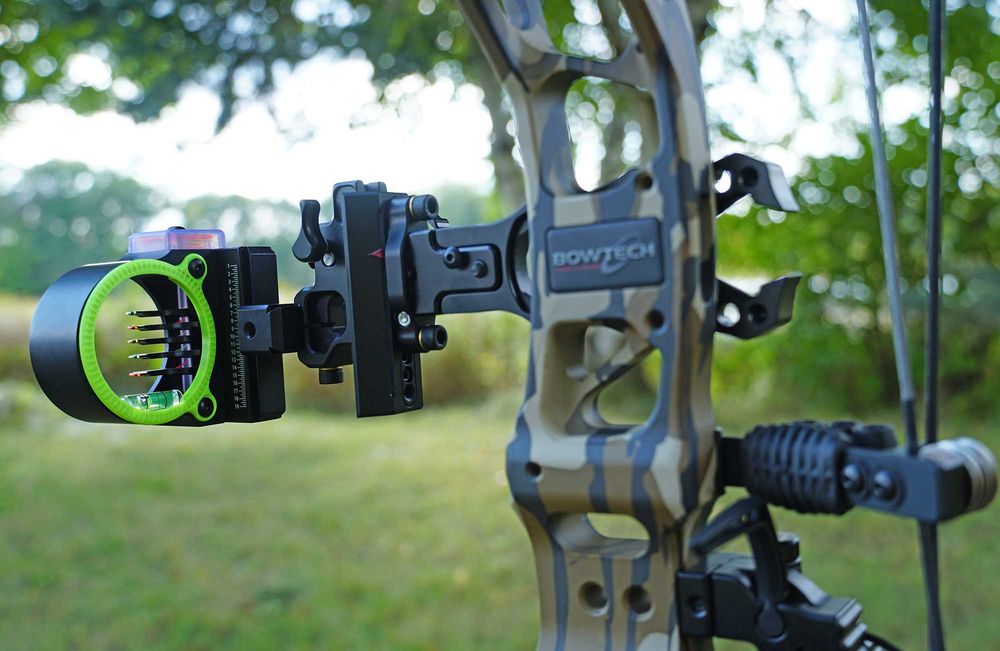 Multi pin bow sight with five fiber optic pins mounted on a hunting compound bow