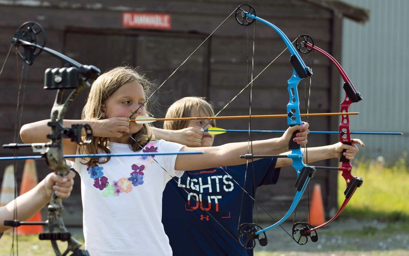 Young NASP archery student takes aim with a Genesis bow at a national championship