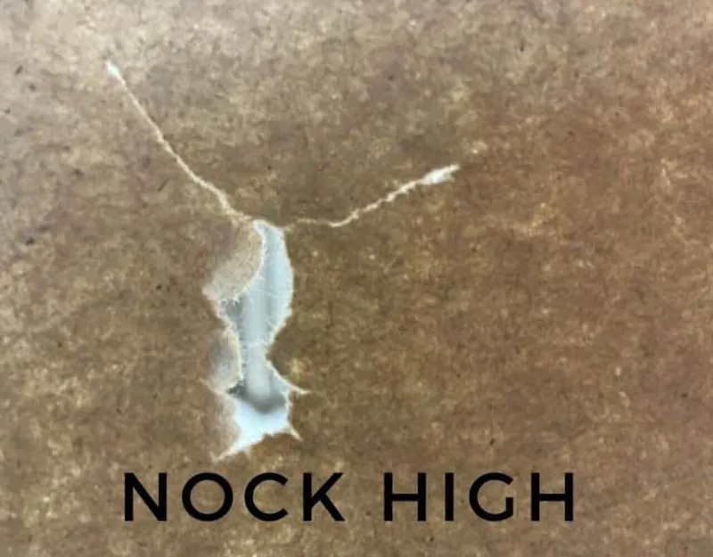 Nock high paper tear from a compound bow
