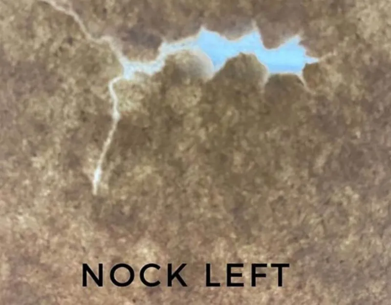 Nock left paper tear indicating arrow rest adjustment