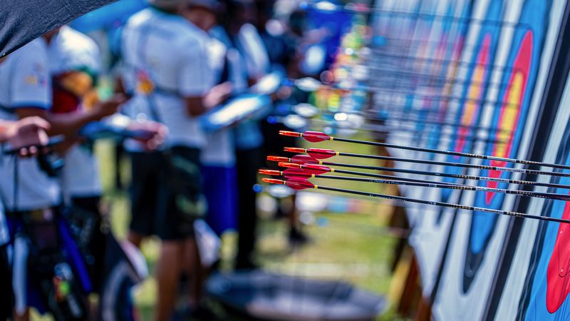 Recurve arrows grouped in a target at the Pan American Archery Championships