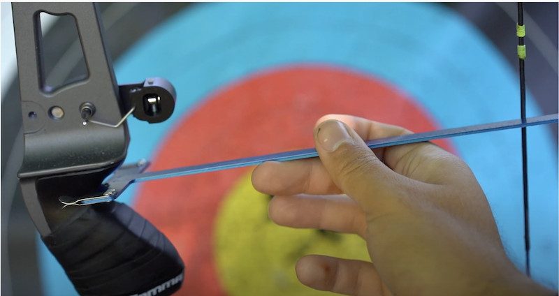 Measuring recurve bow brace height with a bow square after stringing