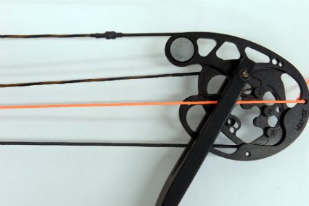Single-cam compound bow showing the timing hole mark with the cable visible through it