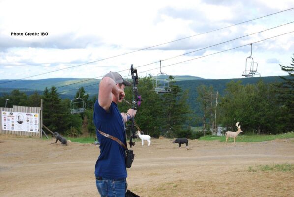 3D archery for beginners: archers shooting foam deer targets on a wooded course