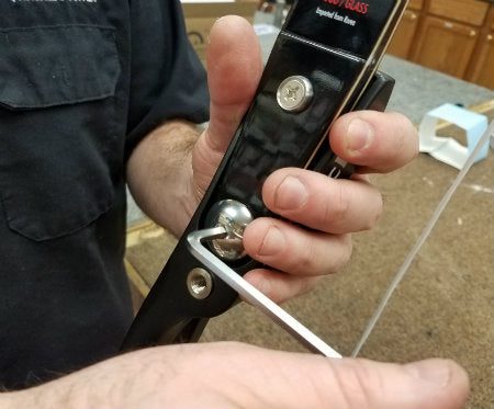 Adjusting beginner draw weight with a recurve limb bolt and hex key