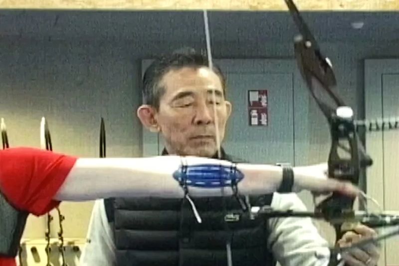 archer indoor practice with arm guard close-range form drill